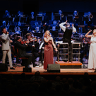 Photograph of singers performing in front of the CBSO at Symphony Hall