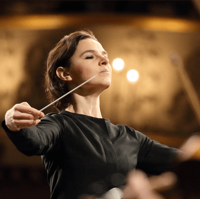 Photograph of Oksana Lyniv conducting.