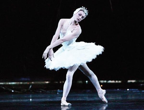 Photograph of ballerina Zenaida Yanowsky dancing in a white tutu.