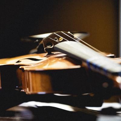 A close-up photograph of a violin.