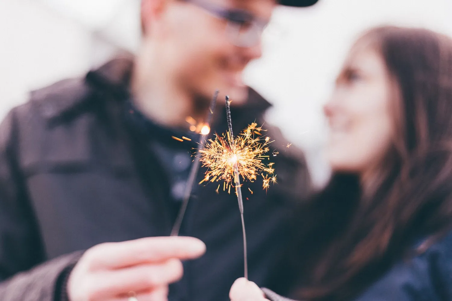 A couple holding sparklers