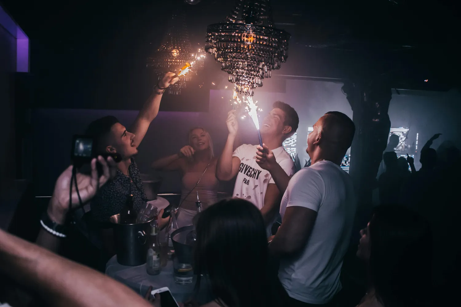 Club goers with ice fountains