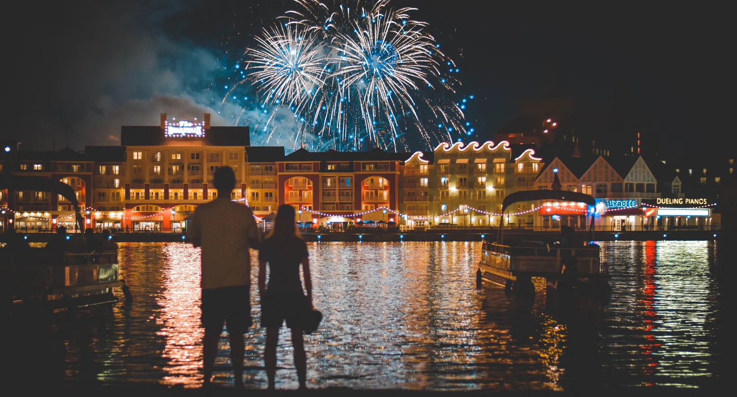 Couple looking out at firework burst