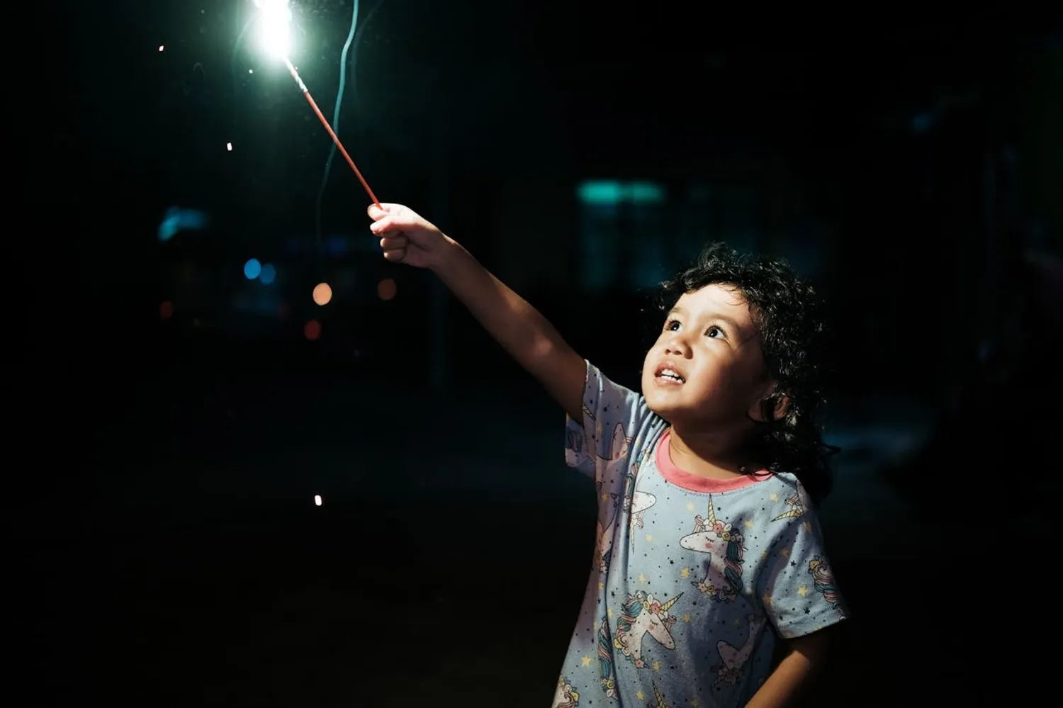 Little boy with blue sparkler
