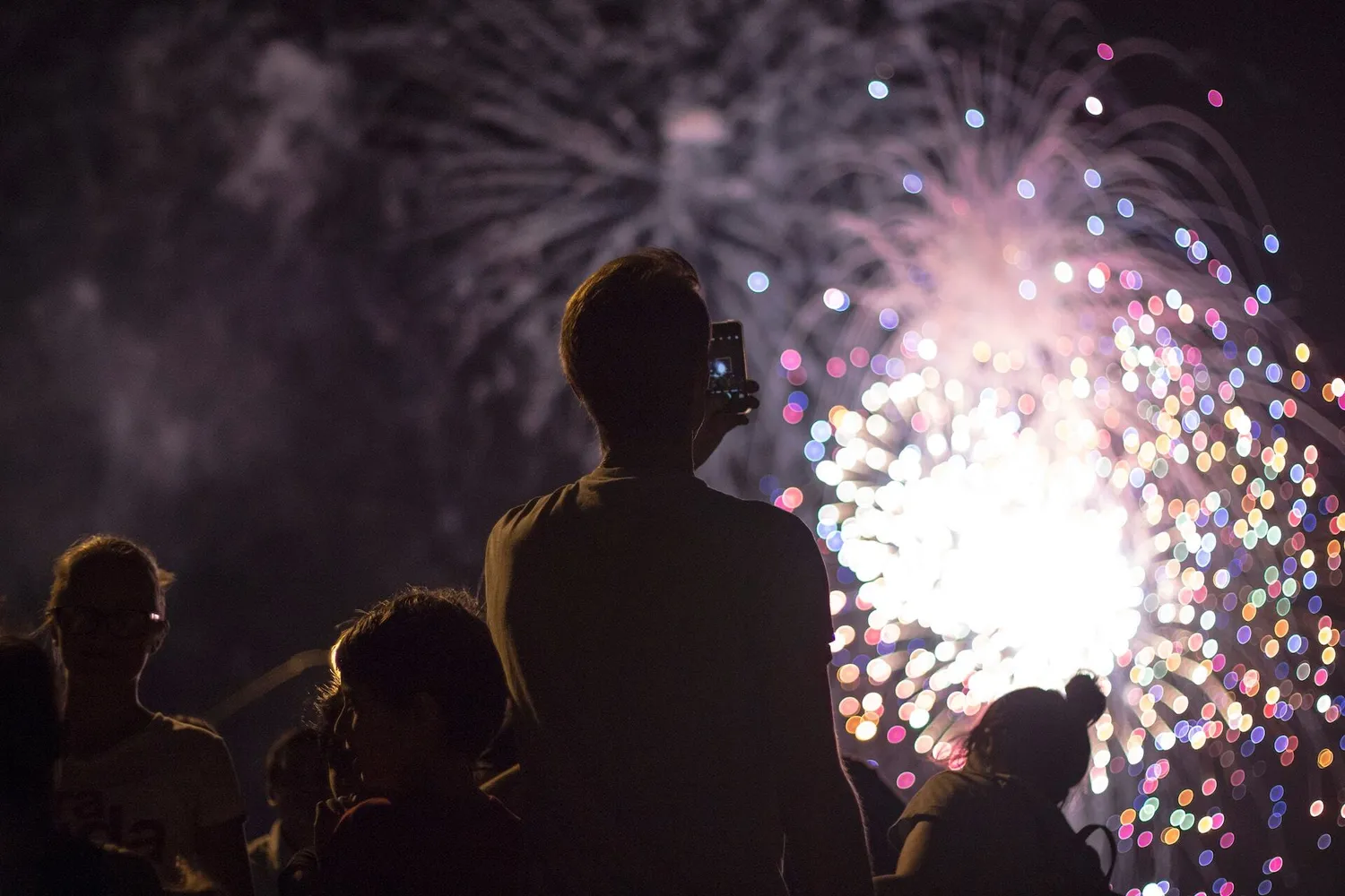 People photograph fireworks
