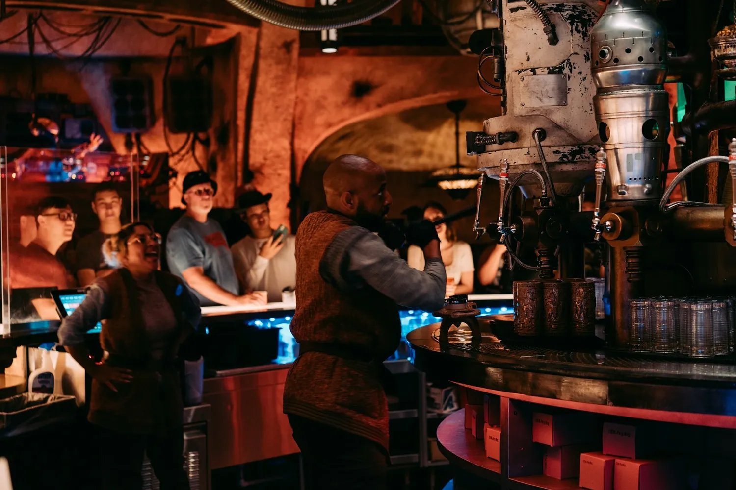 Staff behind a busy bar