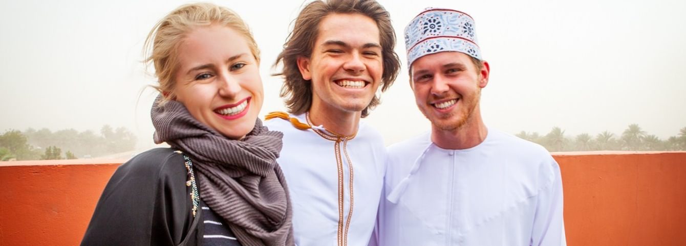 Three CLS Arabic participants wearing Omani clothing.