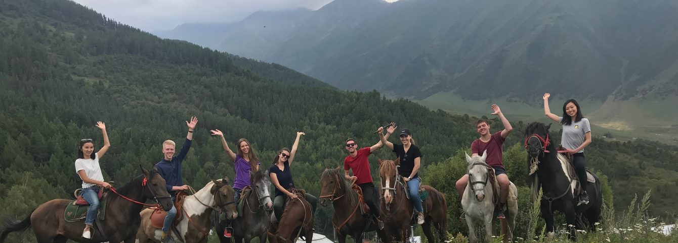 A CLS group riding horses in the mountains of Kyrgyzstan.