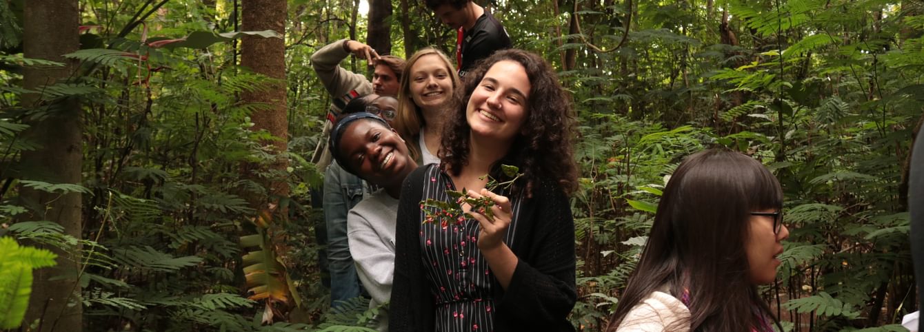 CLS Swahili students walk through a forest in Tanzania.