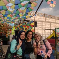 Joy and her language tutors at Kampung Warna-Warni