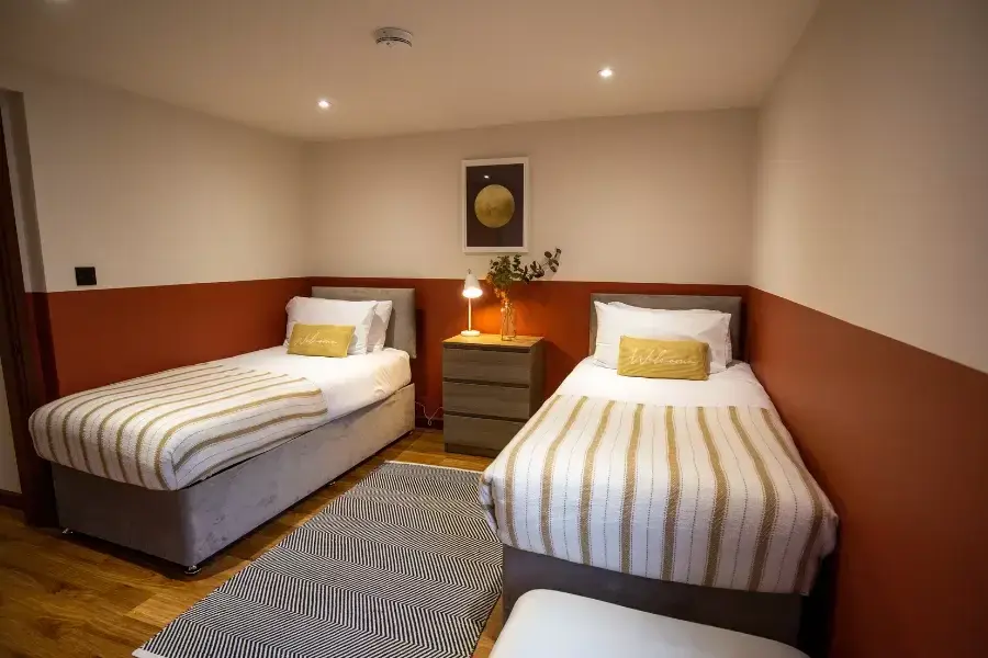 A spacious twin bedroom to relax in