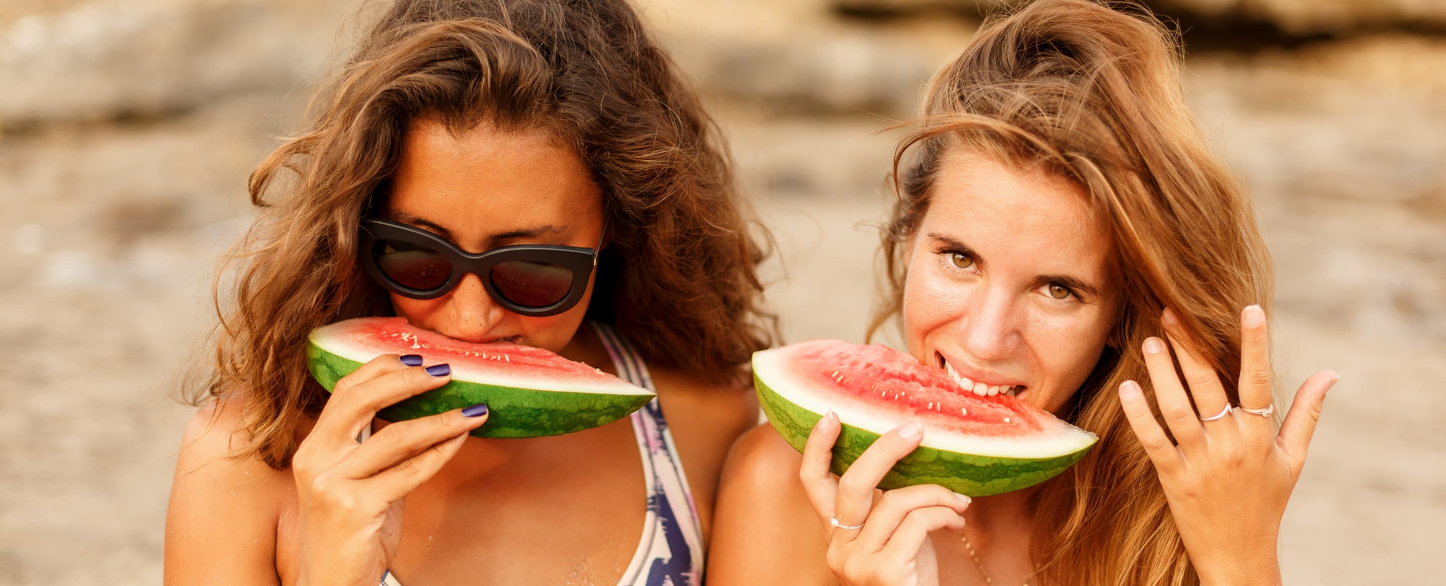 Two beautiful sporty surfer girl at the beach AFEJM27