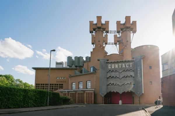 Contact's castle-like exterior with bright blue skies surrounding it