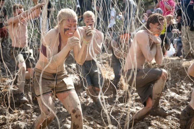 A team of 7 participating in Tough Mudder.