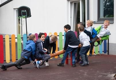 Students playing on playground in school