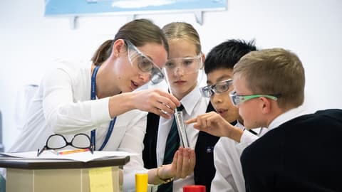Students with teacher learning chemisty