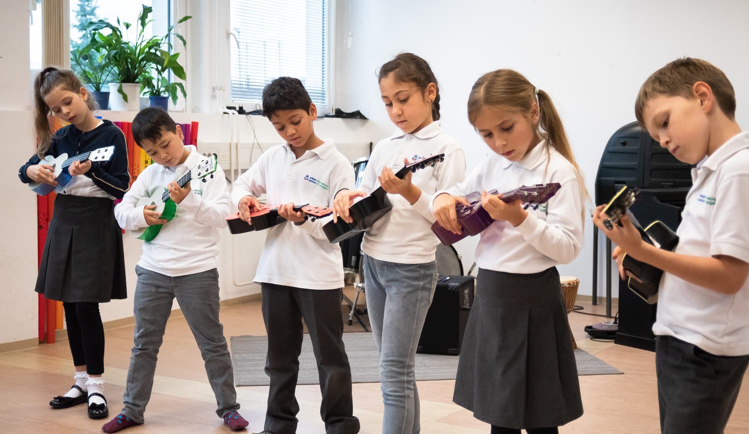 Students playing instruments in school