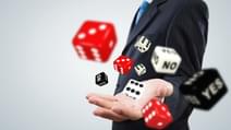 Close up of businessman throwing dice Gambling concept 1