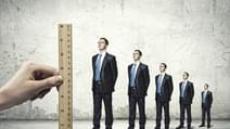 Successful confident businessmen standing in line Progress in career