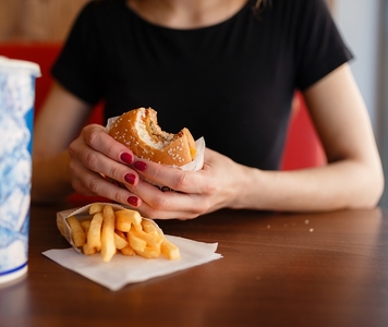 fast food restaurant woman eating