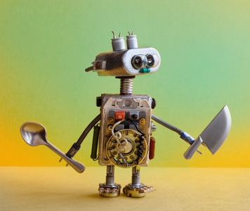 Chef robot holding knife and fork