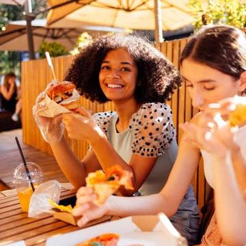 Group of women eating fast food