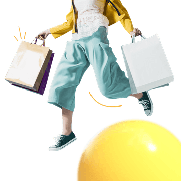 Woman jumping with shopping bags