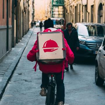 Delivery person on a bike