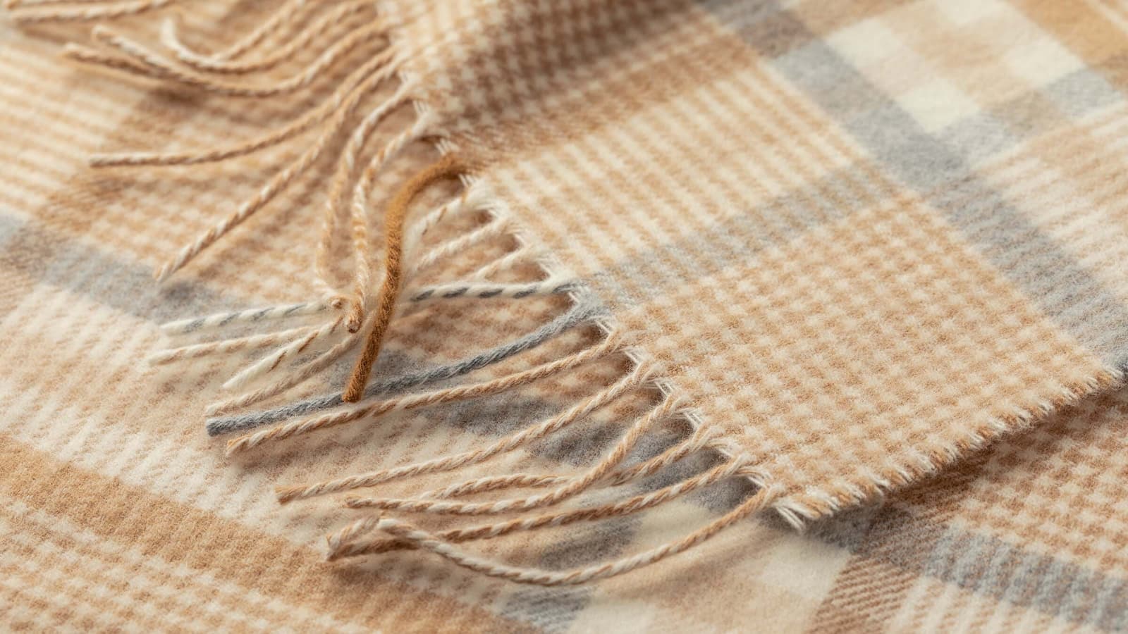 Johnstons of Elgin Merino camel, grey and white check scarf detail