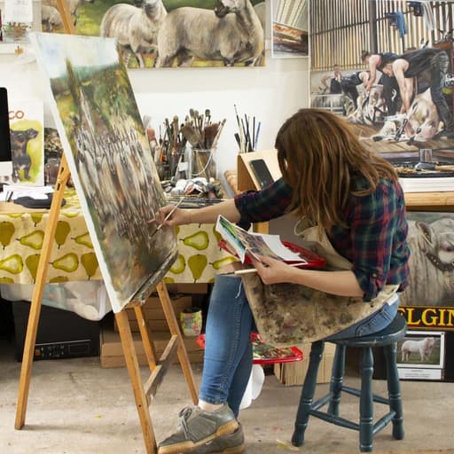 Carolyn Milne Painting in her studio