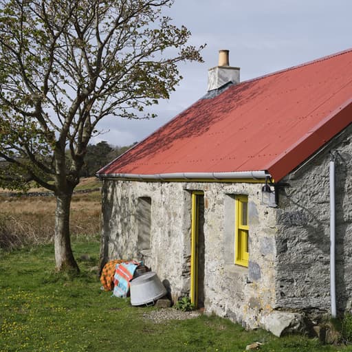 Ben Pentreath’s bothy in Argyll with Johnstons of Elgin's Lambswool throw outside