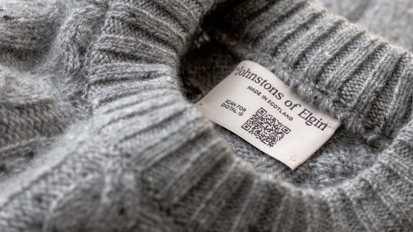 Johnstons of Elgin Cashmere Grey Donegal Round Neck Sweater with Digital ID QR code displayed