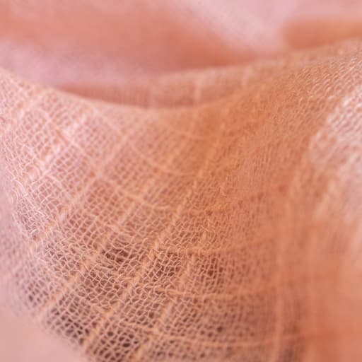 Johnstons of Elgin's lightweight coral pink cashmere shawl detail