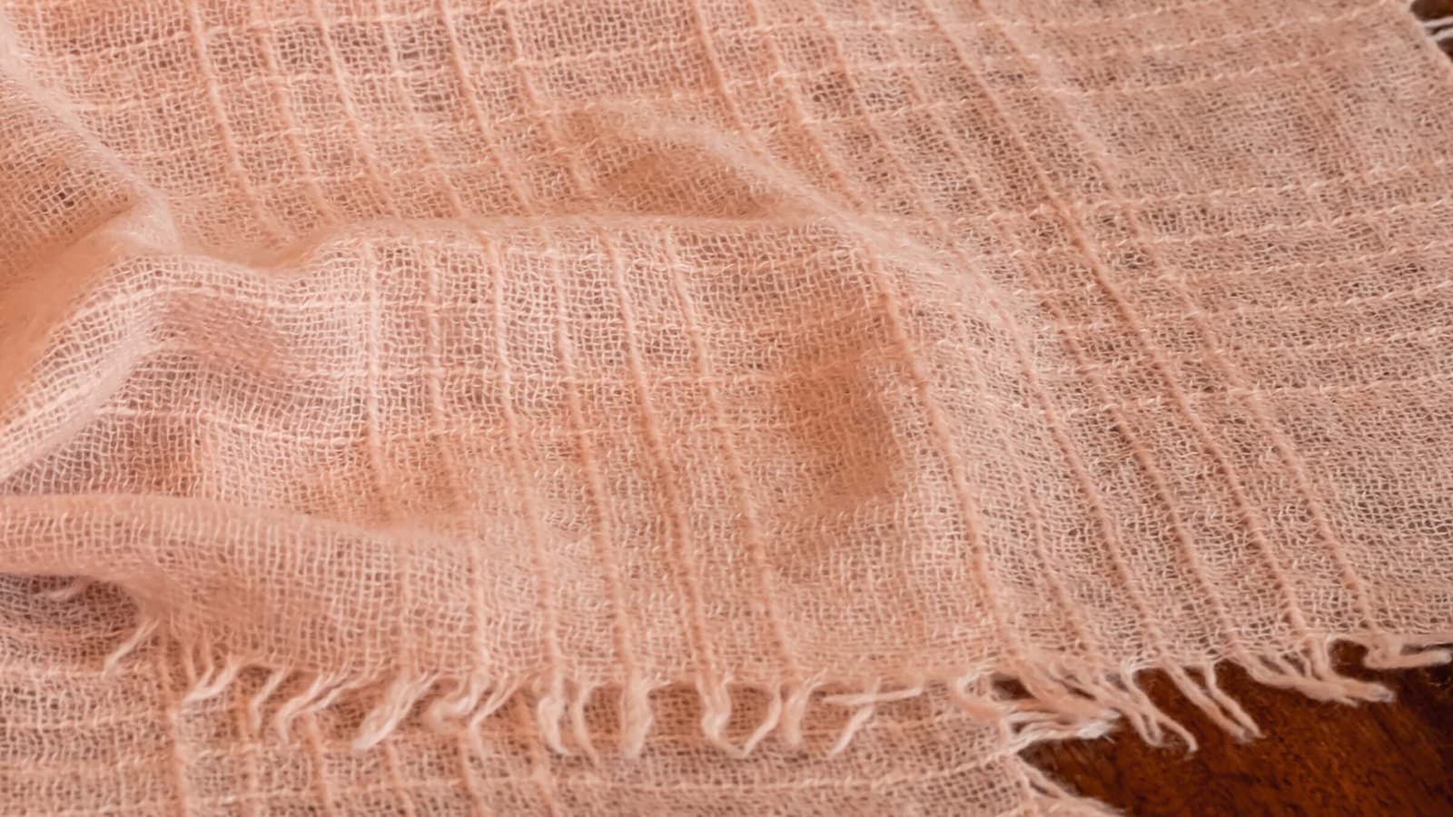 Johnstons of Elgin's lightweight coral pink cashmere shawl