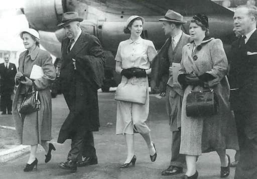 Dame Pattie and Sir Robert (far left) arriving at London Airport for the Queen's coronation with their daughter Helen (centre)