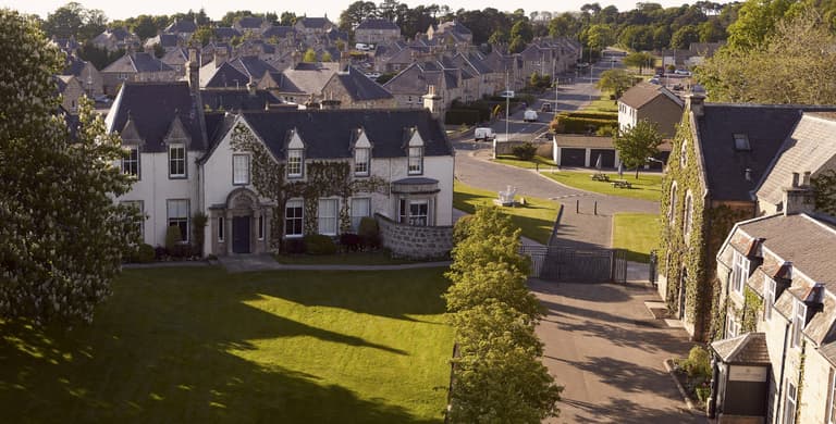 Johnstons of Elgin Mill in Elgin taken by a drone looking over Garvald House and the grounds of our vertical textile mill