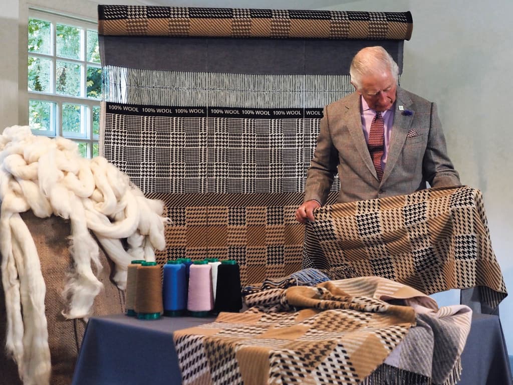 HRH King Charles III inspecting a Johnstons of Elgin Campaign for Wool 10th Anniversary scarf