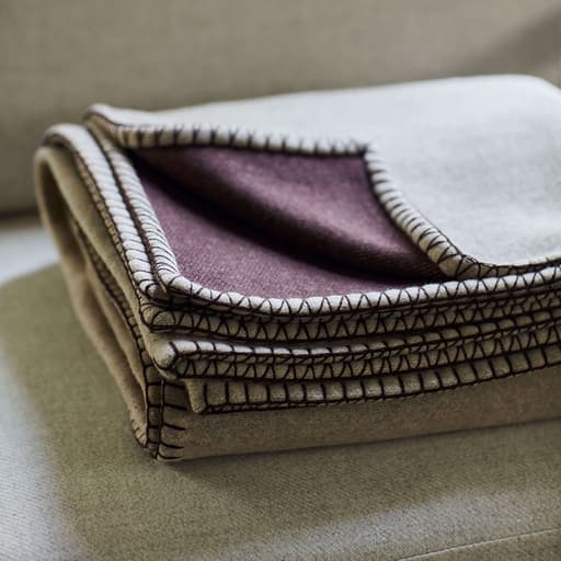 Johnstons of Elgin's Blanket Stitch Reversible Throw in grey and purple