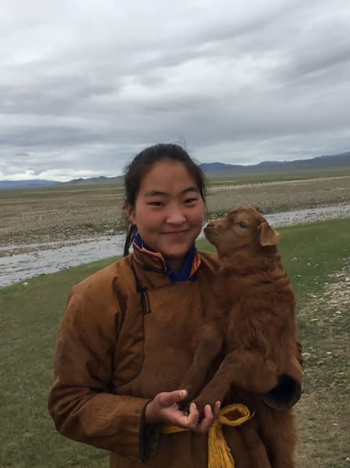 Herder with a goat in Mongolia