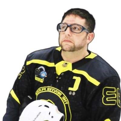 Josh Schneider dressed in hockey uniform