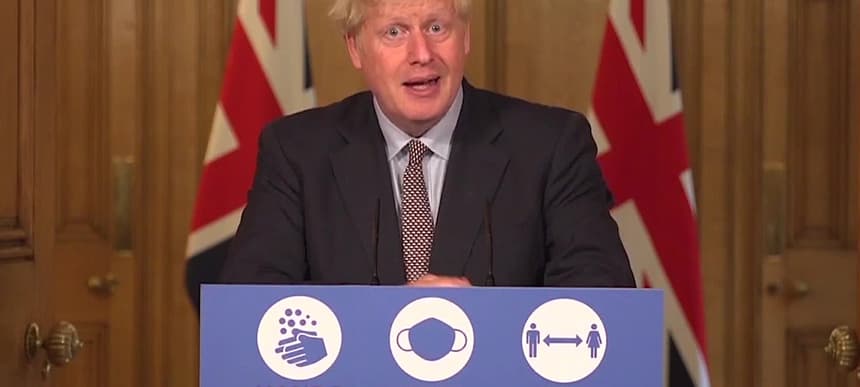 PM Boris Johnson hands face space