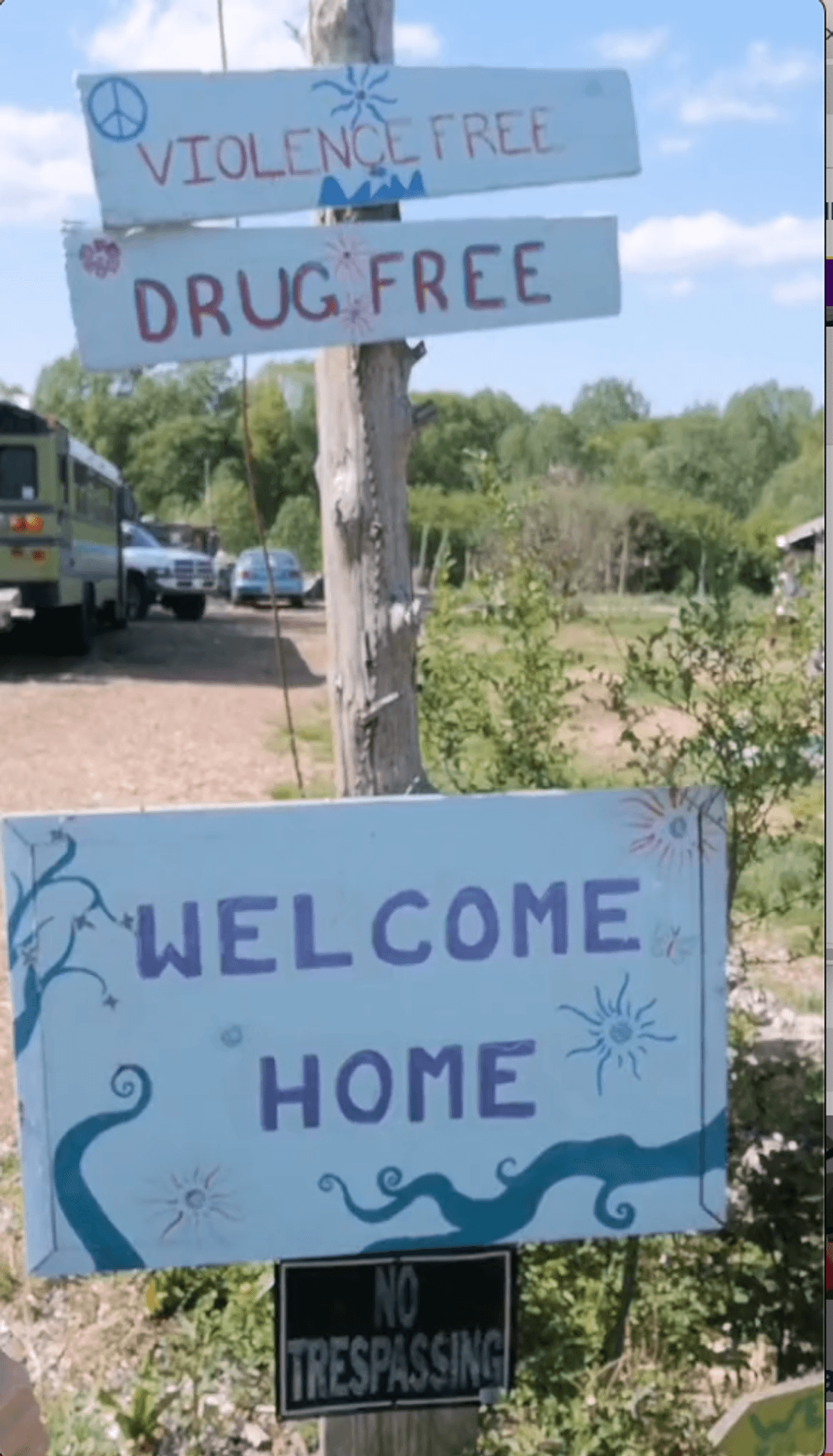 Signs that say "violence free", "drug free", and "welcome home".
