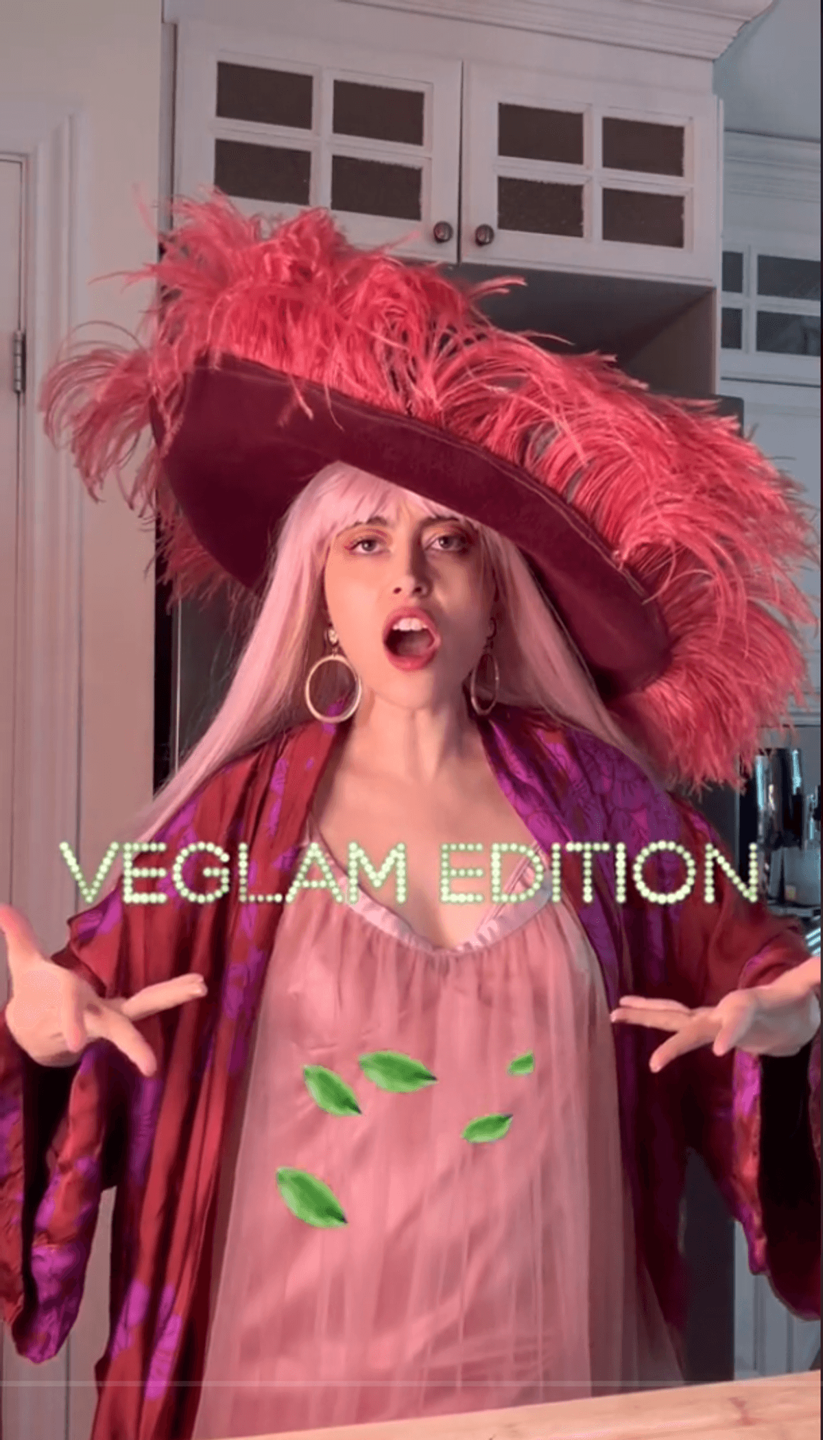 Person dressed in all pink with title "Veglam edition".
