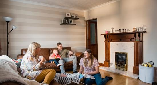Family in living room Adobe Stock 226552440