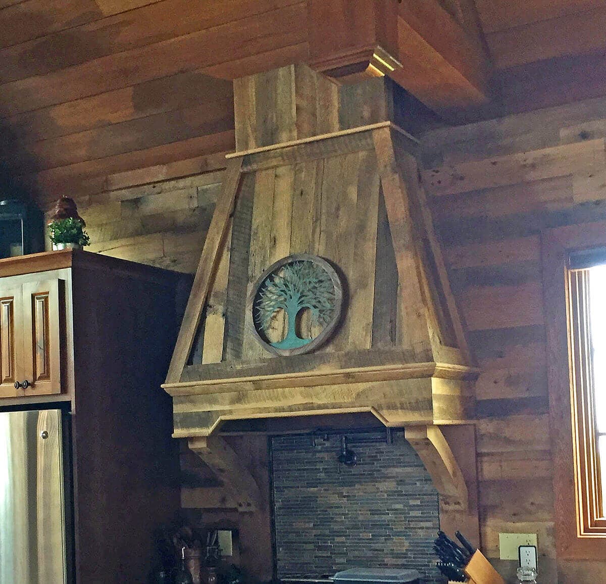 Reclaimed wood cladding on kitchen range hood at Mountain Air RV Resorts