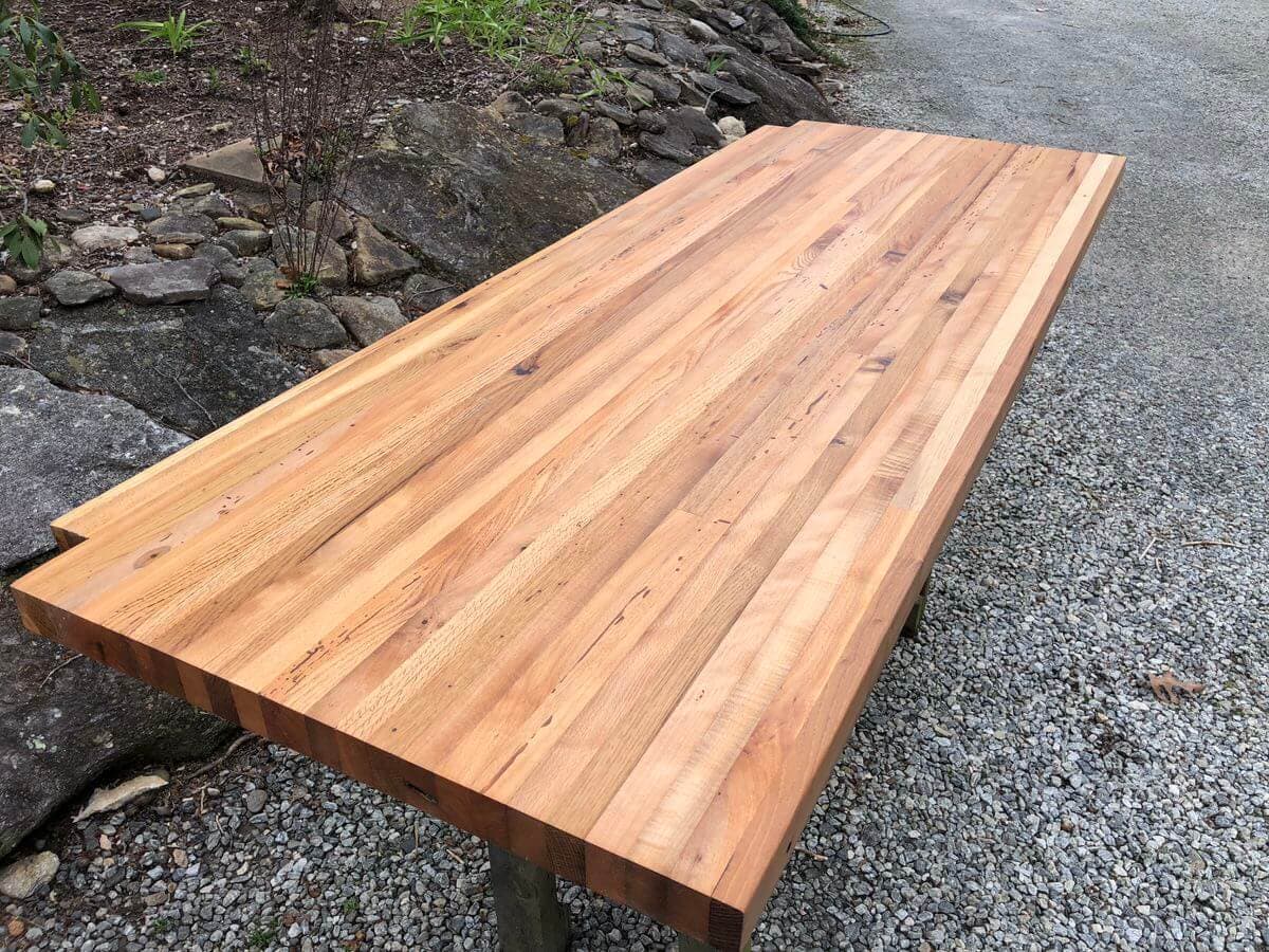 angled image of Reclaimed Mixed Hardwood Butcher Block Counter on gravel