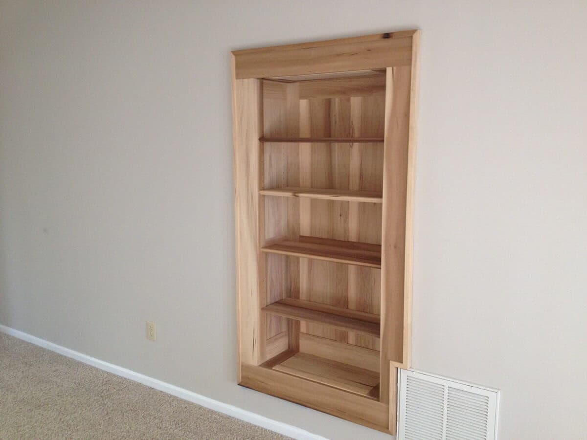 Antique cypress built in bookshelves in flat rock, nc in a bare room