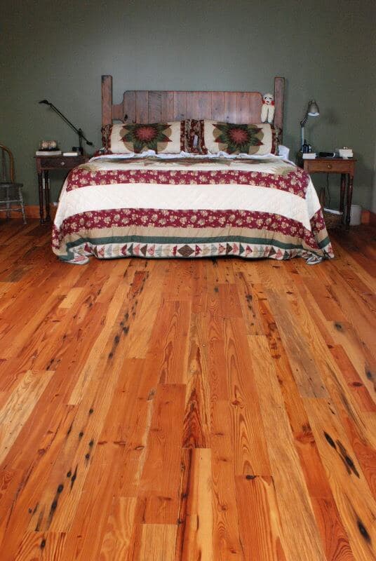 Antique heart pine cabin grade in a bedroom