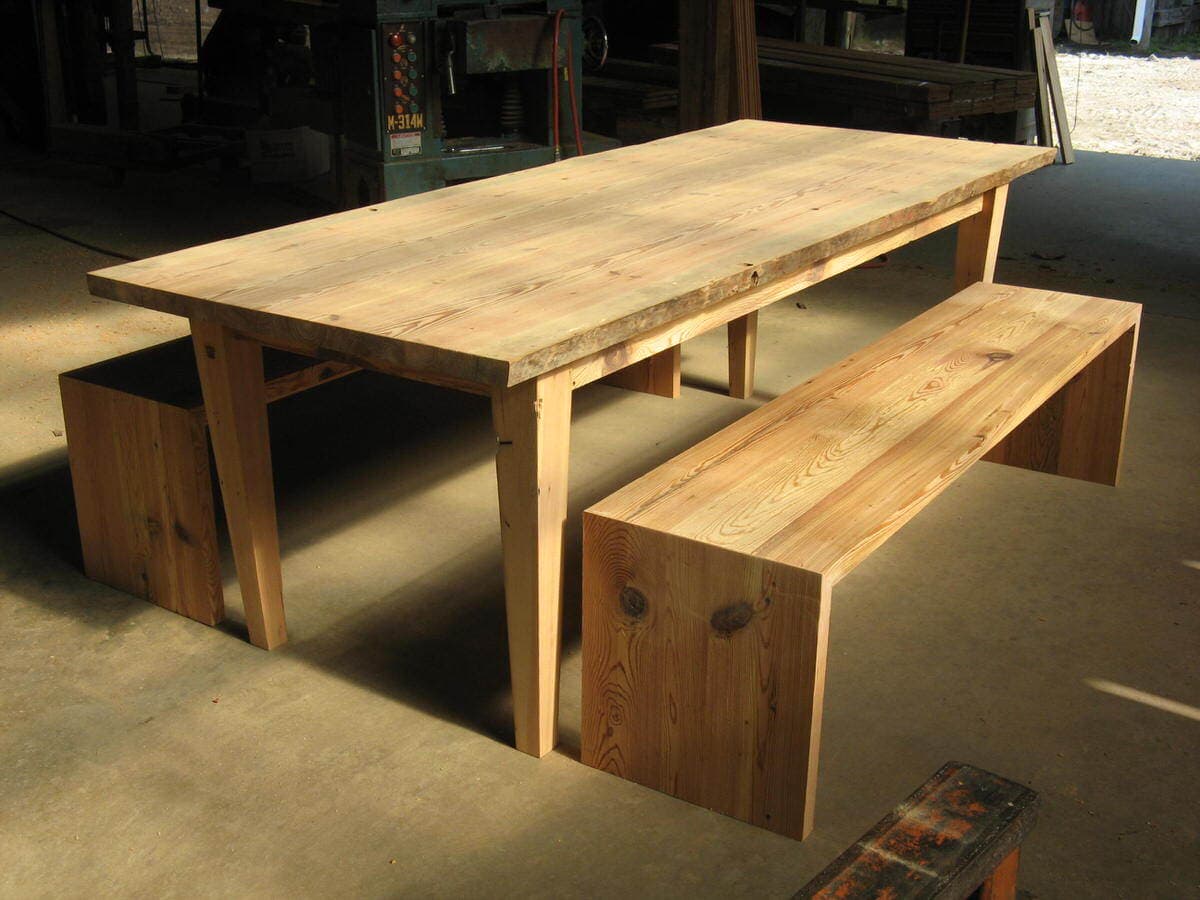 Antique heart pine table and benches unfinished in production facility