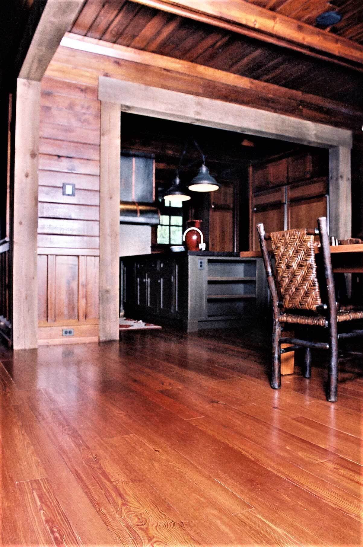 an Antique heartpine floor and a black cane chair in lake toxaway, nc